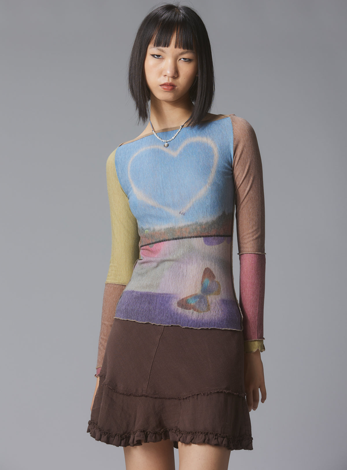 UNIF Skye Top Y2K allover-print mesh top with custom artwork